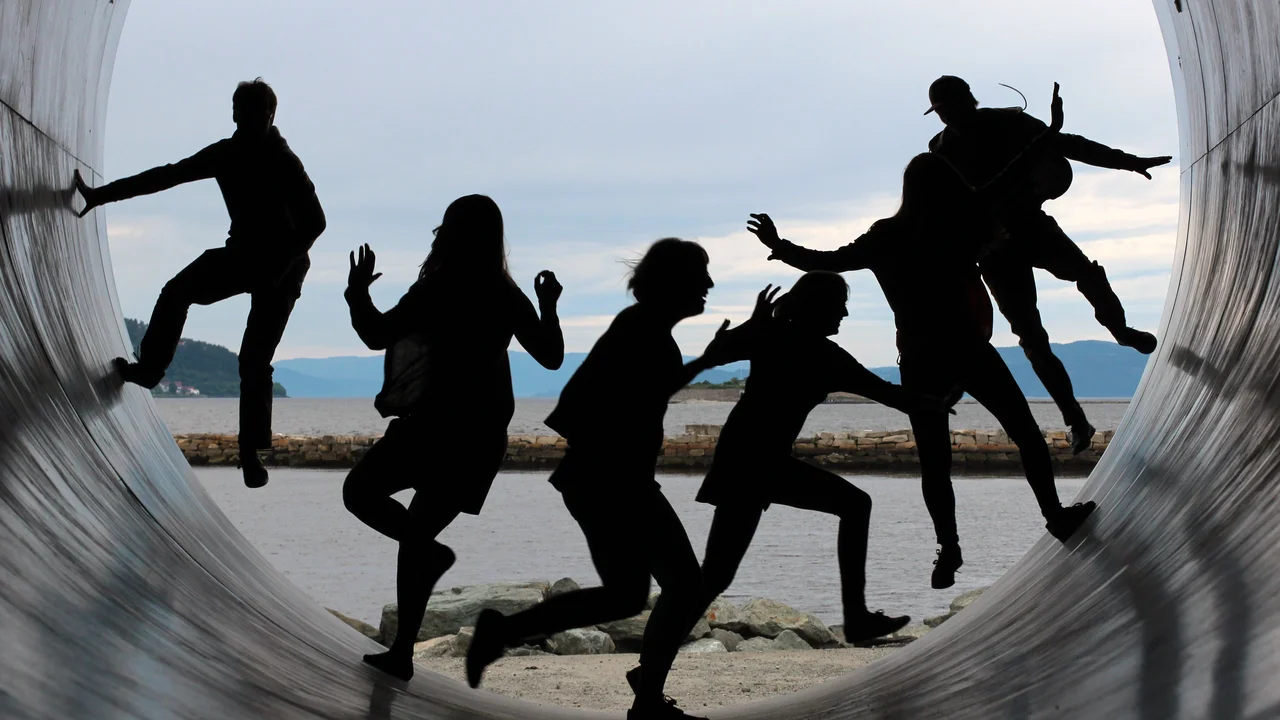 A group of people running in a tunnel