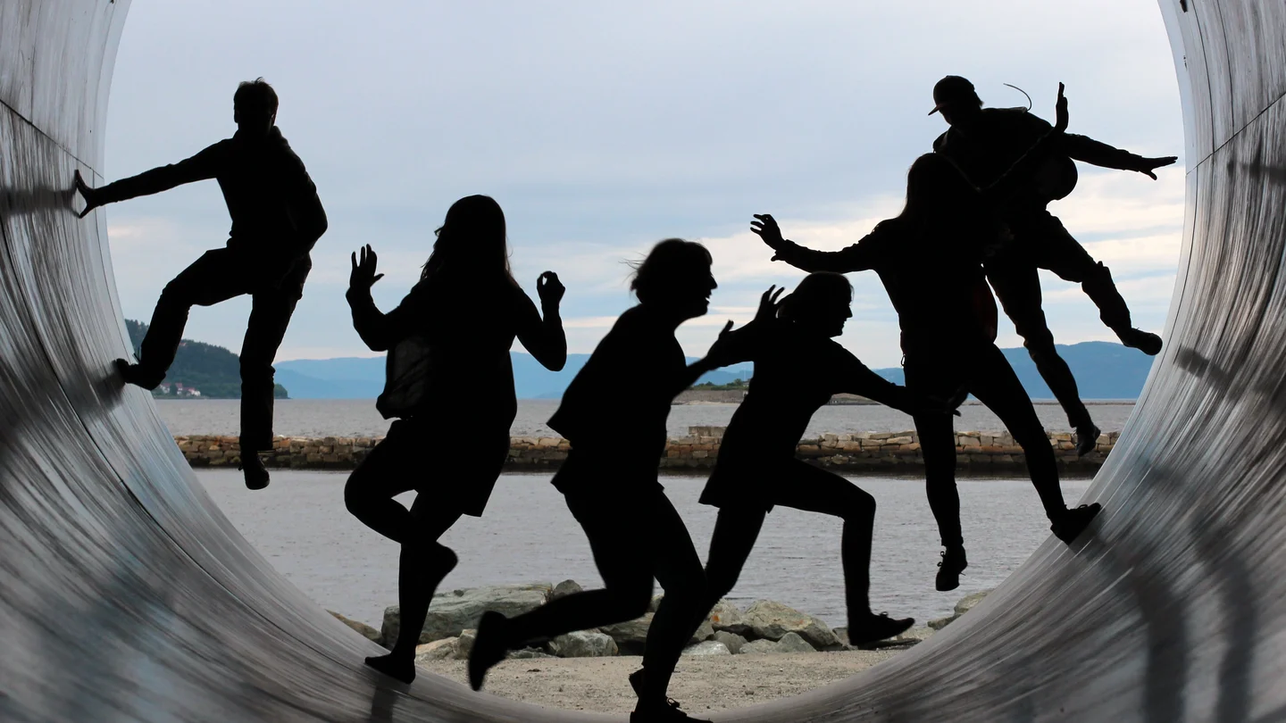 A group of people running in a tunnel